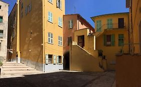 Between The Roofs Of Menton Old Town And The Sea